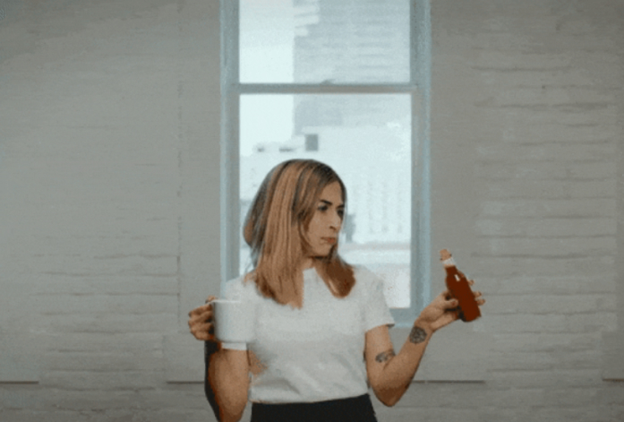 Woman wondering whether she should try Ujjo hot sauce